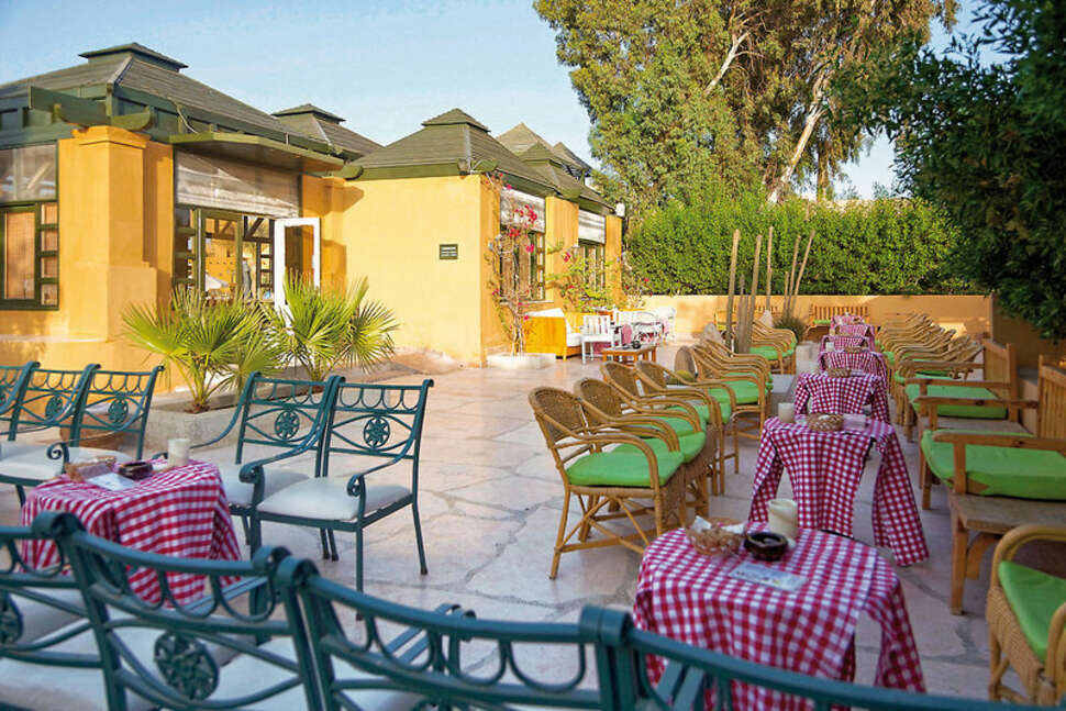 Een foto van het terras bij The Three Corners Rihana Inn