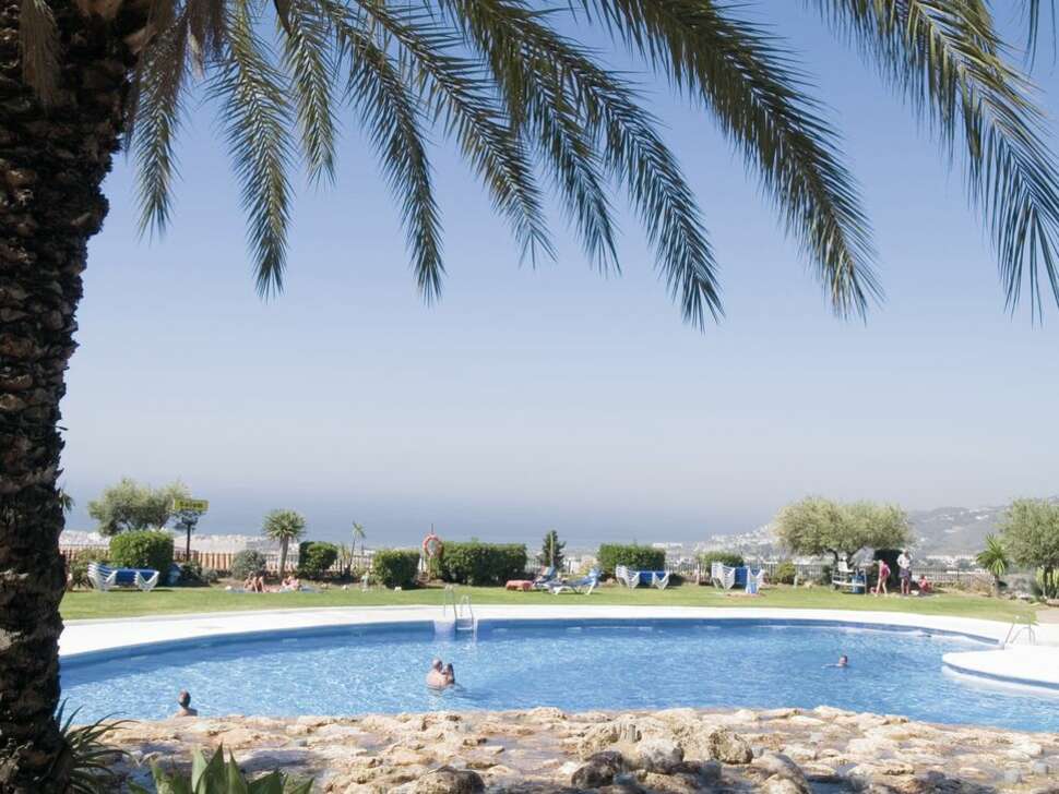Een foto van het zwembad bij El Capistrano Village