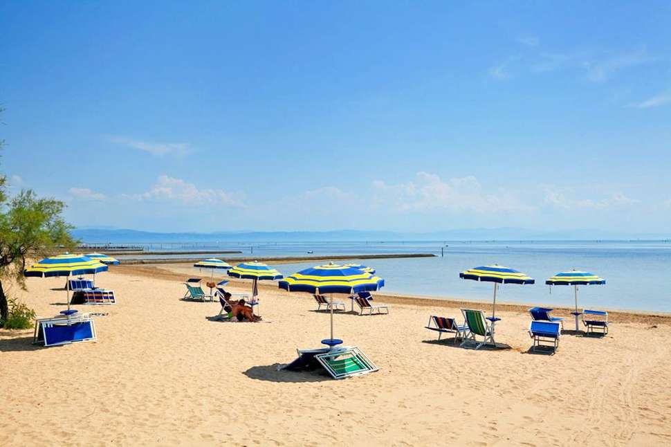 Een foto van het strand bij Club Del Sole Tenuta Primero Grado Family Collection