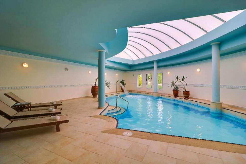 Een foto van het zwembad bij Hotel Aegean Melathron Thalasso & Spa