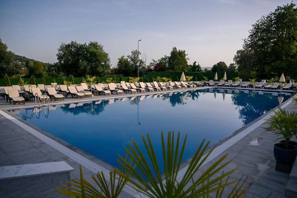 Een foto van het zwembad bij Unique Resort & Spa