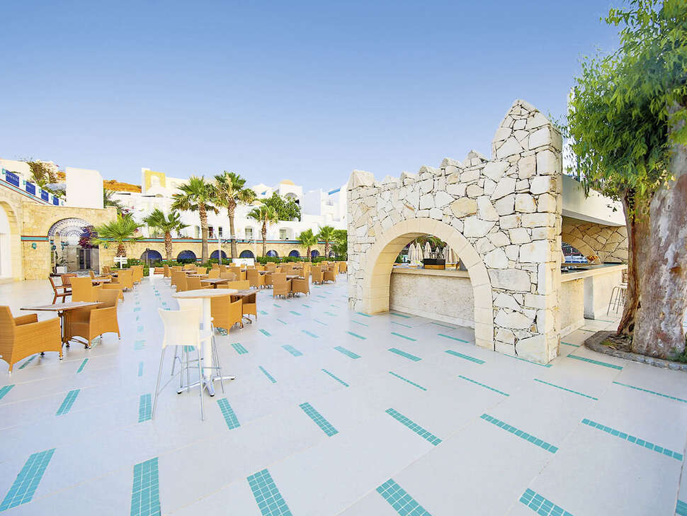 Een foto van het terras bij Salmakis Resort & Spa