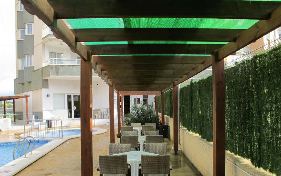 Een foto van het terras bij Playamar Appartementen