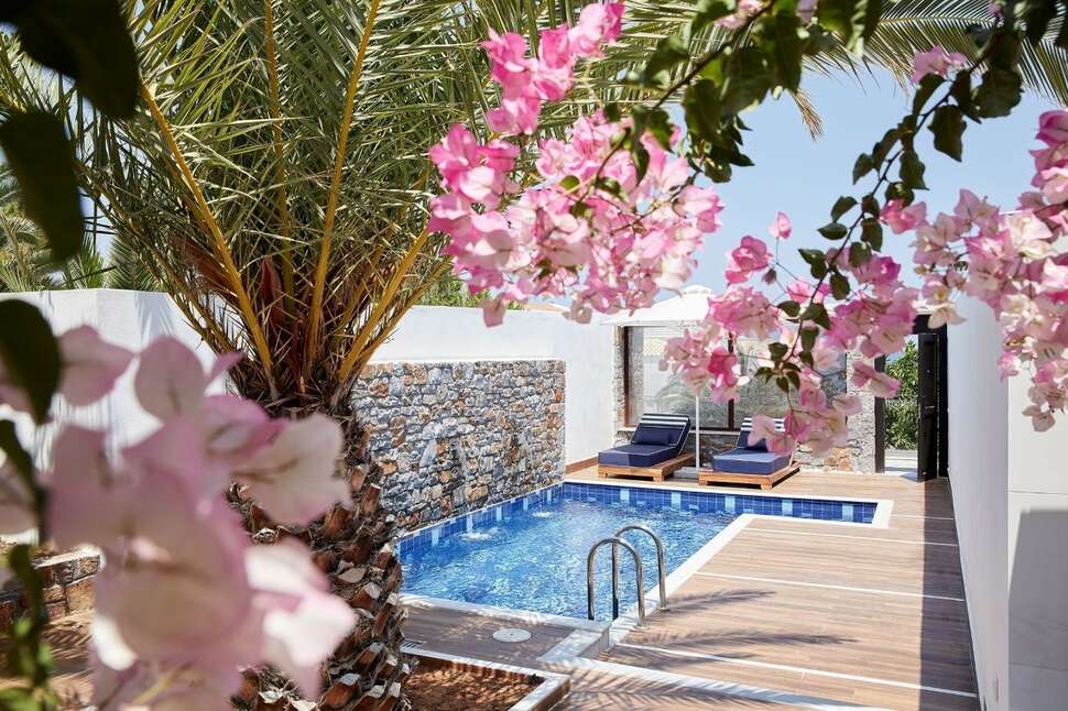 Een foto van het zwembad bij Minos Imperial Luxury Beach Resort & Spa
