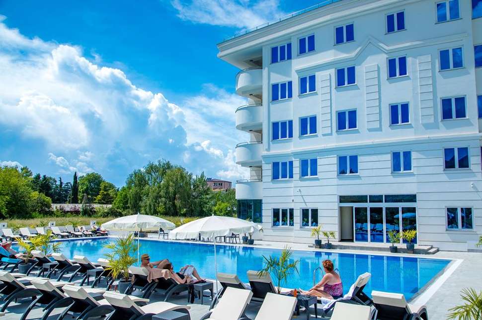Een foto van het zwembad bij Unique Resort & Spa