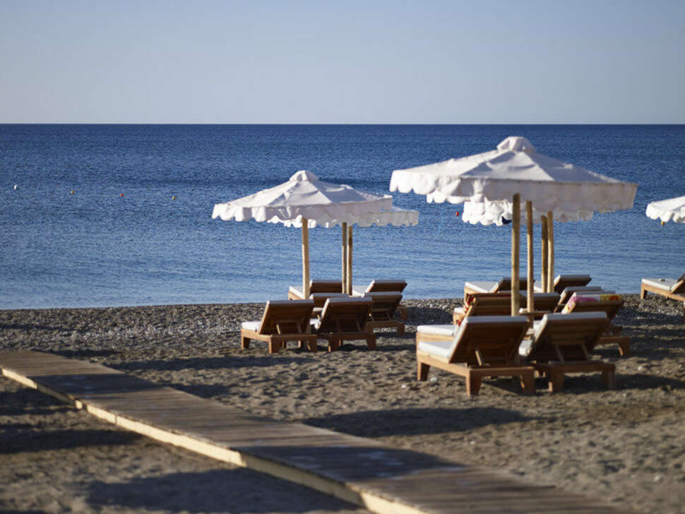 Ein Foto vom Strand beim Mitsis Alila Exclusive Resort & Spa