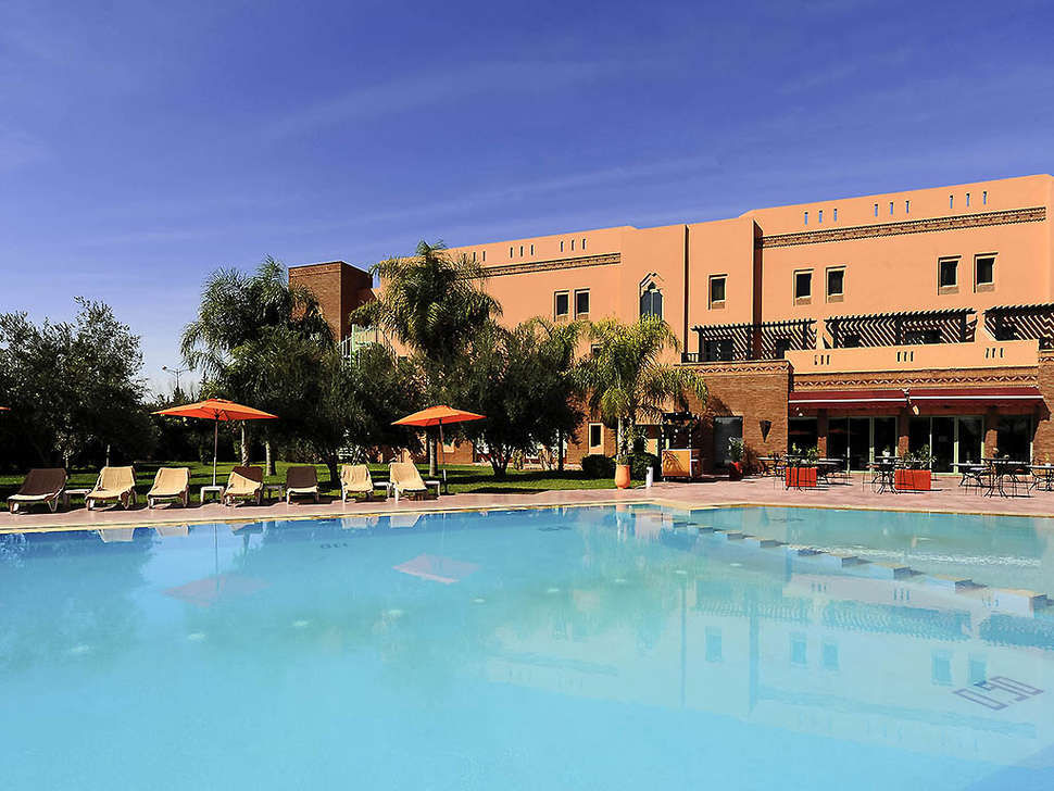 Een foto van het zwembad bij Ibis Marrakech Palmeraie