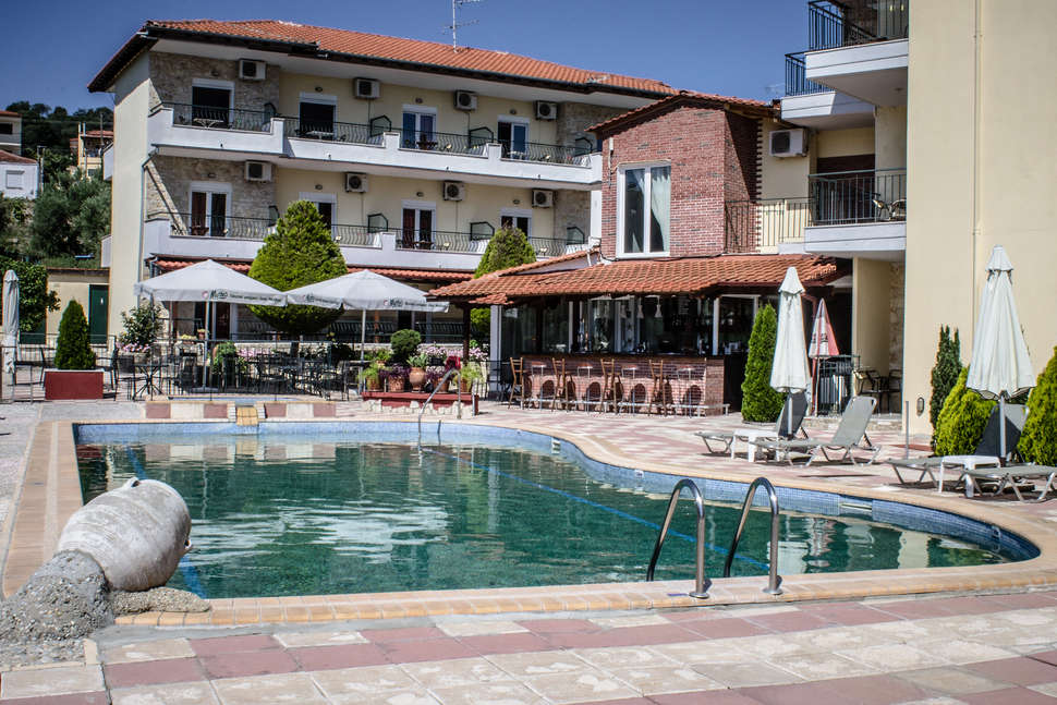 Een foto van het zwembad bij Ilios Hotel