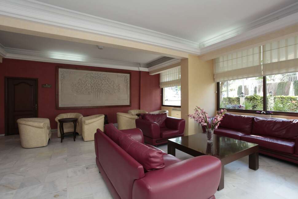 Een foto van het interieur van Palm Hotel