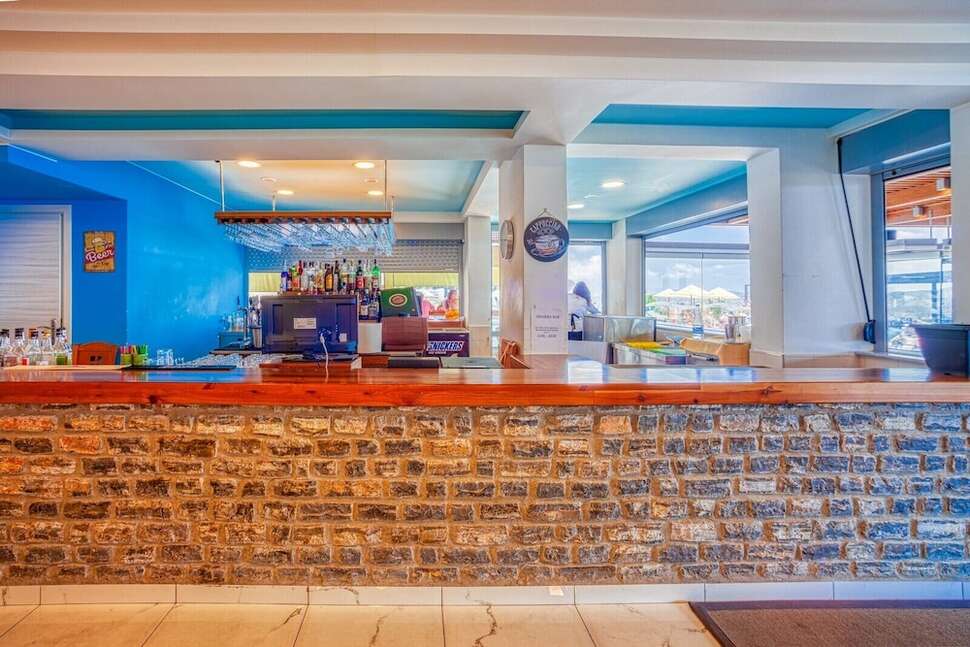 Een foto van het interieur van Elounda Water Park Residence Hotel