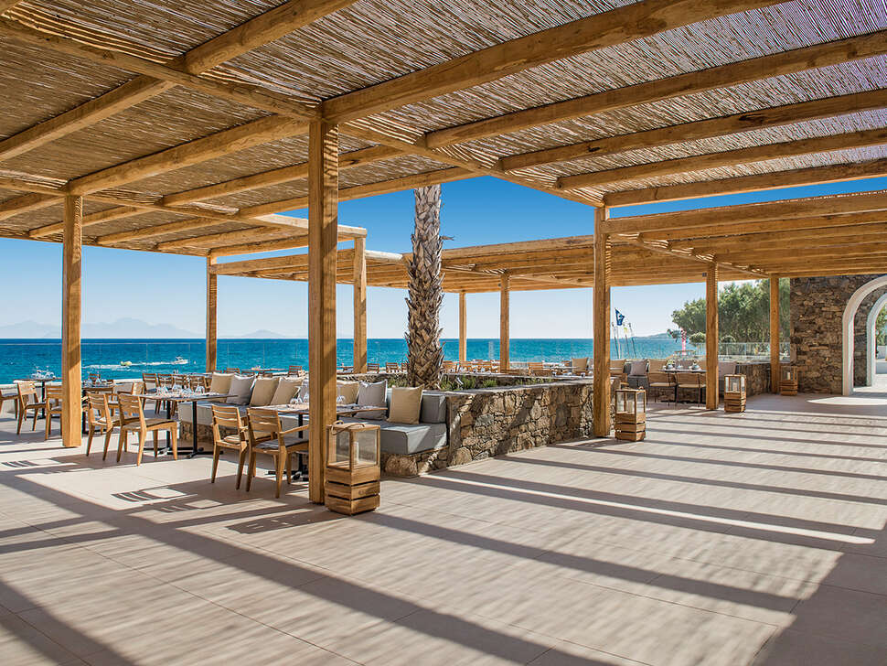 Een foto van het terras bij Mitsis Norida Beach Hotel