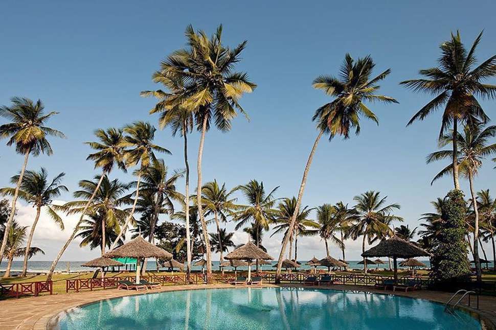 Een foto van het zwembad bij Neptune Village Beach Resort & Spa