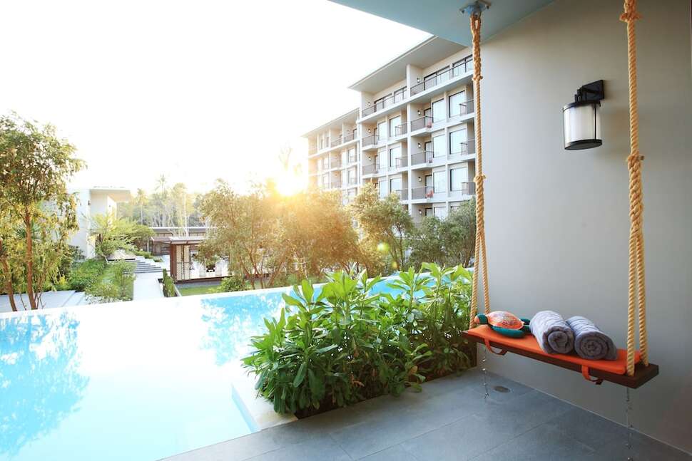 Een foto van het zwembad bij Proud Phuket Hotel