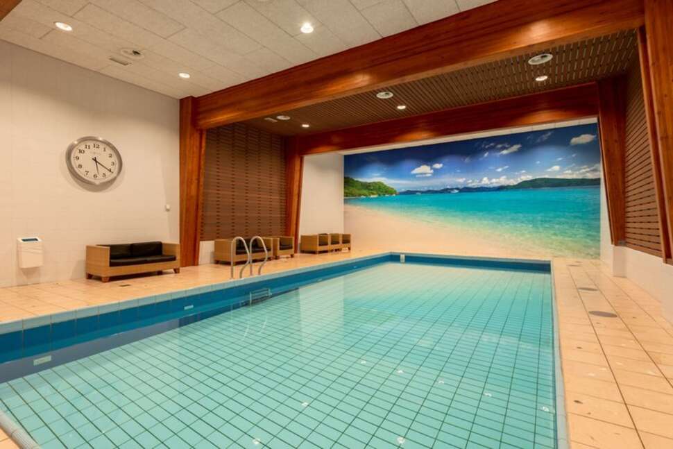 Een foto van het zwembad bij Fletcher Hotel Restaurant Sparrenhorst Veluwe