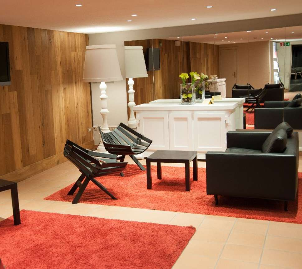 Een foto van het interieur van Charme Hotel Alexander