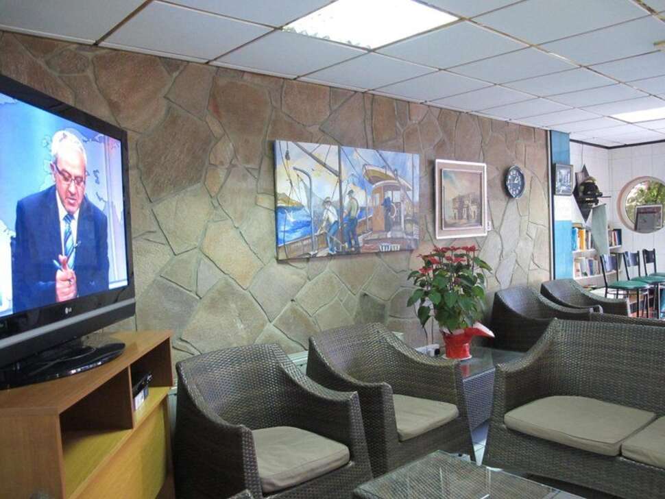 Een foto van het interieur van San Remo Hotel